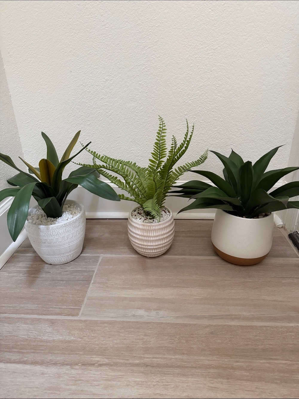 Decorative White Ceramic Ribbed Planter with Green Faux Fern